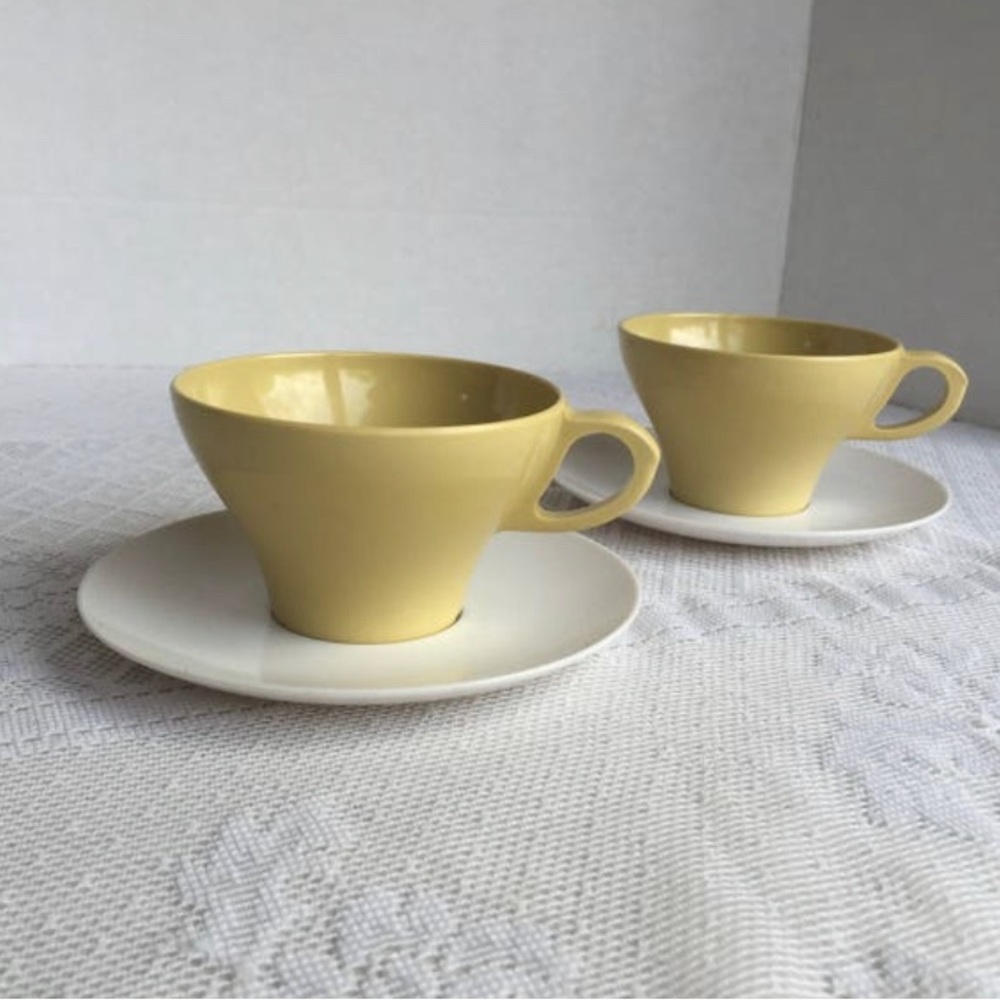 Yellow and White Melamine Cups and Saucers
